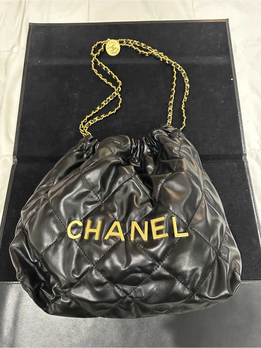CHANEL Black Quilted Leather Drawstring Shoulder Bag with Gold Hardware